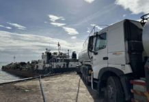 This Dec. 17, 2023 photo shows trucks and a motor tanker that personnel of the National Bureau of investigation and Bureau of Customs seized in Mariveles, Bataan. ABS-CBN NEWS/JOB MANAHAN PHOTO