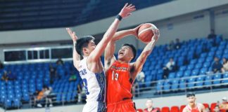NorthPort Batang Pier’s John Amores attempts to score against the defense of TNT Tropang Giga’s Calvin Oftana. PBA PHOTO
