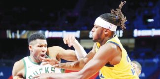 Indiana Pacers’ Myles Turner attempts to grab the ball from Milwaukee Bucks' Giannis Antetokounmpo. AP Photo. AP PHOTO