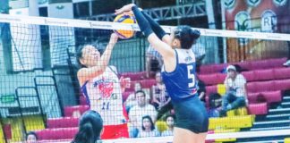 Negros ICC Blue Hawks’ Christine Joy Apan with a two-handed block against a San Juan Lady Knights Go For Gold player. Photo courtesy of MPVA PHOTO