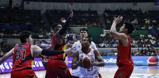 San Miguel Beermen’s Rodney Brondial, Moala Tautuaa and Celedonio Trollano attempt to stop Barangay Ginebra San Miguel Kings’ Sidney Onwubere from scoring inside. PBA PHOTO