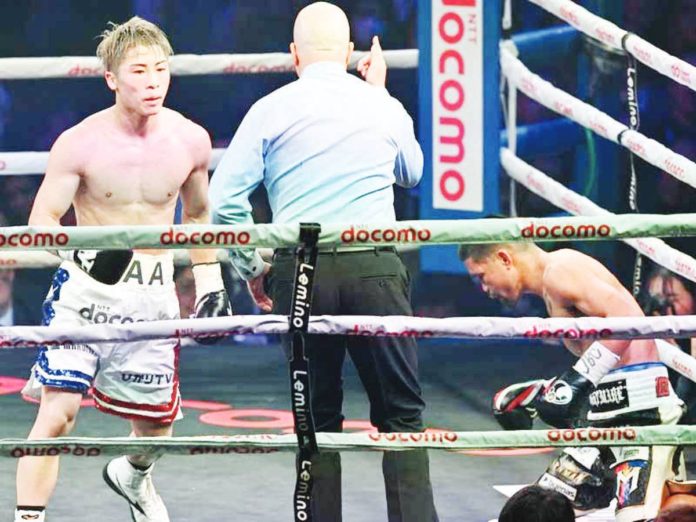 tapales-inoue_resized Japan's Naoya Inoue fights with Philippines’ Marlon Tapales (right) during their four-belt world super bantamweight title unification match at Tokyo's Ariake Arena on Dec. 26, 2023. PHOTO COURTESY OF KAZUHIRO NOGI / AFP