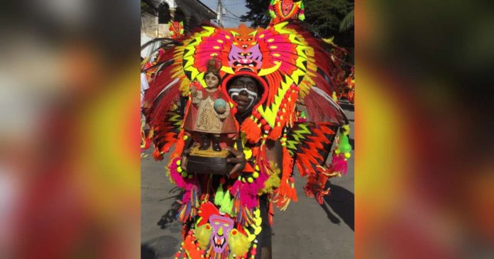 Kalibo_superimposed Kalibo, Aklan’s Ati-atihan Festival has served as impetus and inspiration for many festivals all across the archipelago, thus the “Mother of All Philippine Festivals” tag. The photo shows a tribe warrior holding an image of Sr. Sto. Niño, for whom the celebration is in honor. BOY RYAN ZABAL PHOTO / AKEAN FORUM
