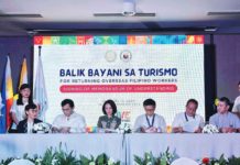 Departments of Tourism secretary Christina Garcia-Frasco and Department of Migrant Workers officer-in-charge Hans Leo Cacdac (sitting, 3rd and 4th from left, respectively) lead the signing of an agreement for the Balik Bayani sa Turismo program on Jan. 18, 2024. DEPARTMENT OF MIGRANT WORKERS PHOTO