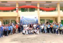 PAGCOR-FUNDED SCHOOL BUILDING UNVEILED IN TARLAC PAGCOR officers and Pura local officials pose with teachers and students of Nilasin 1st Elementary School in front of the new building.