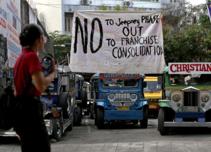 PUV_resized A streamer at a terminal for jeepneys plying the Paco-Rotunda Nagtahan route in Manila expresses the unyielding position of the local transport association about the government’s modernization program for public utility vehicles, in this photo taken on Tuesday, Jan. 2, 2024. Photo by RICHARD A. REYES / Philippine Daily Inquirer