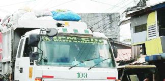 A vehicle of Bacolod City’s current sanitary services provider collects, hauls, and disposes of garbage. PNA FILE PHOTO