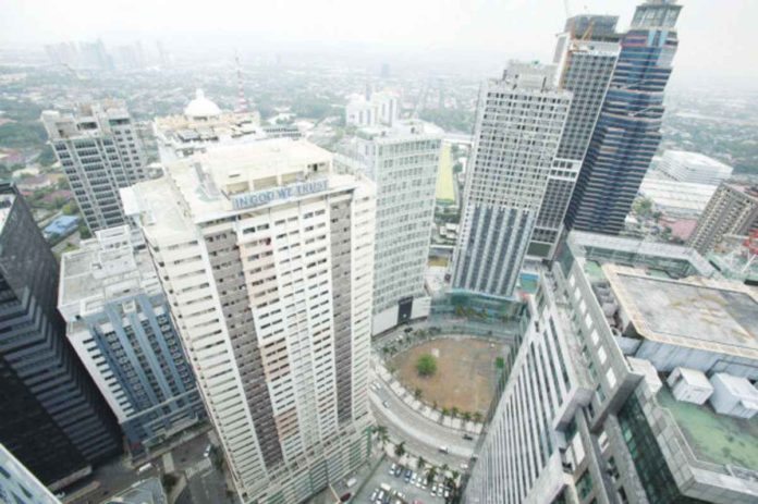 economic_outlook_resized The skyline of a business district is seen from a commercial building in Ortigas, Pasig city, Metro Manila. REUTERS/ROMEO RANOCO/FILE PHOTO
