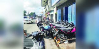 Motorcycles from a retail establishment illegally occupy the sidewalk in front of a high school in Bacolod City. The local traffic authority deemed the obstruction a hazard. JOSE ANTONIO ROBELLO PHOTO