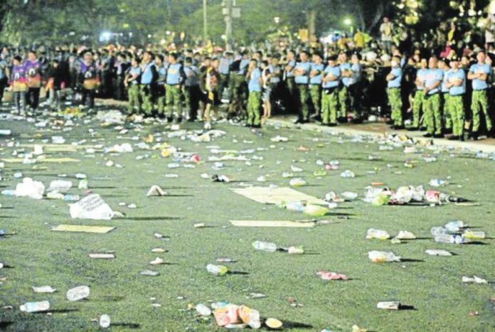 garbage Trash litters the grounds of Rizal Park after millions of devotees leave Quirino Grandstand to join the “traslacion” or grand procession of the Black Nazarene to Quiapo Church. RICHARD A. REYES