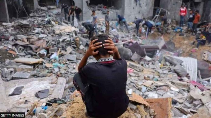 israel_resized A child reacts as people salvage belongings amid the rubble of a damaged building following strikes on Rafah in the southern Gaza Strip in November 2023. More than 21,800 people have been killed in Gaza - mostly children and women. GETTY IMAGES
