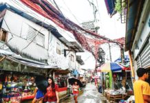 New lifeline subsidy for poor electricity consumers take effect Electrical cables crisscross one another as electric meters hang on posts in Barangay Old Capitol, Quezon City on July 11, 2023. MARIA TAN/ABS-CBN NEWS PHOTO