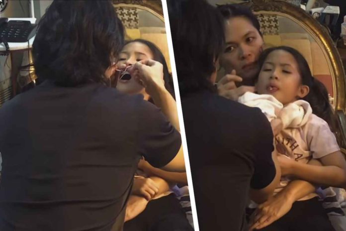 ryan-agoncillo Ryan Agoncillo removes his daughter Luna's baby tooth. SCREENSHOTS FROM RYAN AGONCILLO’S INSTAGRAM REEL