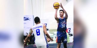 Negrense Jeff Manday of Meralco Bolts pulls up for a shot against the defense of TNT Triple Giga’s Chris Exciminiano. PBA PHOTO