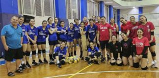 Members of Bacolod Tay Tung High School Thunderbolts (in blue jerseys) during their training session with some members of San Beda University Lady Red Spikers. PHOTO COURTESY OF JOSE MONTALBO