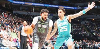 Minnesota Timberwolves' Karl-Anthony Towns attacks the defense of Charlotte Hornets’ P.J. Washington. PHOTO COURTESY OF GETTY IMAGES