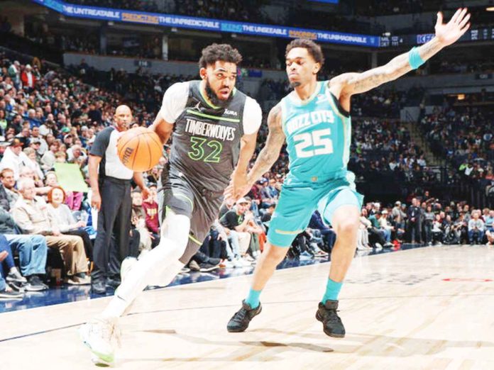 sports_hornets_resized Minnesota Timberwolves' Karl-Anthony Towns attacks the defense of Charlotte Hornets’ P.J. Washington. PHOTO COURTESY OF GETTY IMAGES