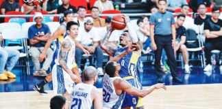 Magnolia Chicken Timplados Hotshots’ Tyler Bey goes for a tough shot against TNT Tropang Giga’s Rahlir Hollis-Jefferson. PBA PHOTO