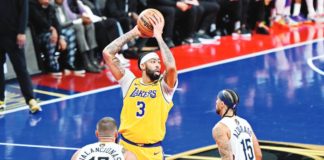 Los Angeles Lakers’ Anthony Davis looks to pass the ball while being defended by New Orleans Pelicans’ Jonas Valanciunas and Jose Alvarado. NBA PHOTO