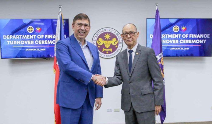 turnover_pic_resized Former Finance secretary Benjamin Diokno officially turns over the Department of Finance leadership to newly appointed Finance secretary Ralph Recto in a ceremony in Manila on Monday, Jan. 15. The turnover ceremony was followed by a series of briefings for Recto, led by the heads of DOF offices. DOF PHOTO