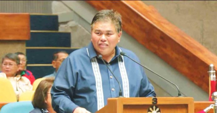 NEPC_pic_resized Cong. Gus S. Tambunting, chairman of the House of Representatives' committee on legislative franchises, presents his committee report on House Bill 9310, which outlines the transfer of the franchise from Central Negros Electric Cooperative to Negros Electric and Power Corporation, at the Batasang Pambansa plenary hall on Tuesday, Feb. 13.