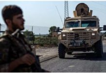 Drone attack kills six Kurdish-led fighters at US base in east Syria File photo showing a fighter of the Syrian Democratic Forces (SDF) standing guard along a road in the town of al-Busayrah, in Syria’s Deir al-Zour province. AFP