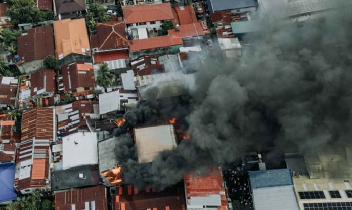 fire 1 Around 150 individuals were displaced by a fire that broke out in Barangay San Nicolas, La Paz, Iloilo City past 4 p.m. on Sunday, February 18. The Bureau of Fire Protection Iloilo City has yet to determine the cause of the blaze. This aerial photograph captures the extent of the fire damage. MORE POWER ILOILO/FACEBOOK PHOTO