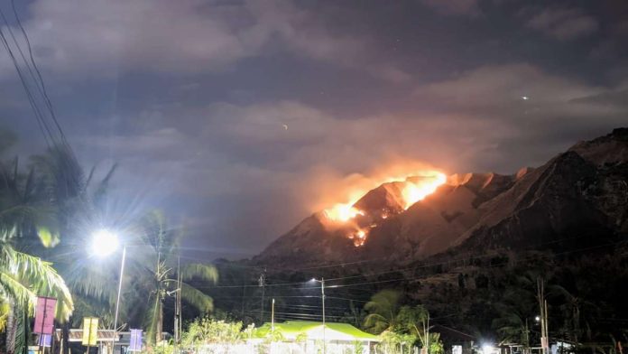 A forest fire razed a portion of Mt. Napulak covering barangays Corucuan, Tigbanaba, Lab-on, and Bagay in Igbaras, Iloilo on Friday night, February 23. BERT ESPOSADO PHOTO