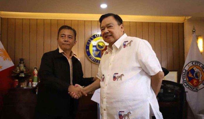 nava_pic_resized Sumakwel Nava Jr. (left) takes his oath of office before Mayor Jerry P. Treñas as the newly-appointed councilor of Iloilo City on Wednesday, Feb. 7. ILOILO CITY MAYOR’S OFFICE PHOTO