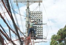 ERC: Lower power bill possible before Christmas if VAT on system loss removed One of the Manila Electric Co. linemen inspects the power meters on a concrete post along Kaliraya Street in Quezon City. PNA PHOTO BY JESS M. ESCAROS JR.