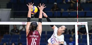 Ateneo de Manila University Blue Eagles’ Lyann de Guzman smashes the ball towards the defense of University of the Philippines Fighting Maroons’ Stephanie Bustrillo. UAAP PHOTO