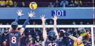 Far Eastern University Lady Tamaraws’ Gerzel Petallo slams the ball towards two University of the East Lady Warriors defenders. UAAP PHOTO