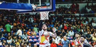 San Miguel Beermen’s June Mar Fajardo goes for a one-hander against the defense of Magnolia Chicken Timplados Hotshots’ Calvin Abueva. PBA PHOTO