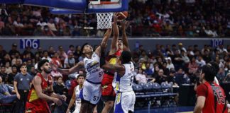 San Miguel Beermen’s Celedonio Trollano goes for a layup against the defense of Magnolia Chicken Timplados Hotshots’ Aris Dionisio and Abu Tratter. PBA PHOTO