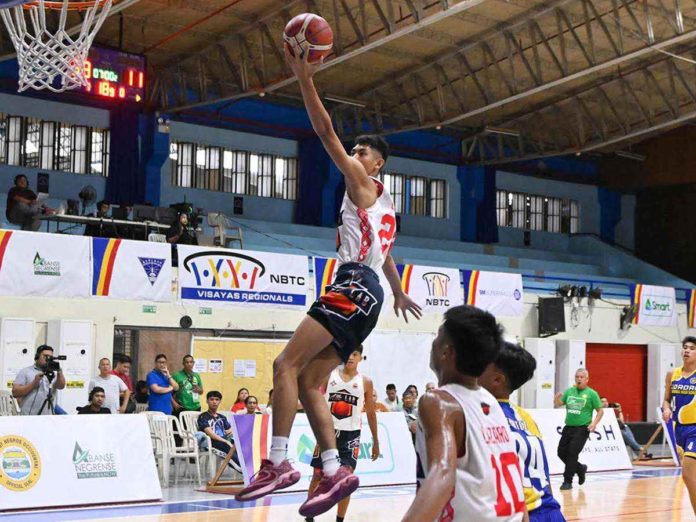 sports_st_resized_resized St. Robert’s International Academy Panda Rockets-Elite Lab’s Rengie Ecarma soars for a layup. PHOTO COURTESY OF NBTC