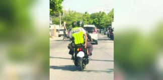 This Bacolod Traffic Authority Office enforcer was seen backriding on a motorcycle with no helmet. CONTRIBUTED PHOTO