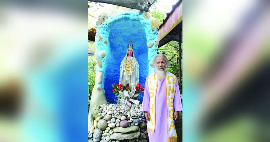 Manong Danny wears a special robe when practicing faith healing. He also has a sculpture of the Blessed Virgin Mary he had custom-made in his house.