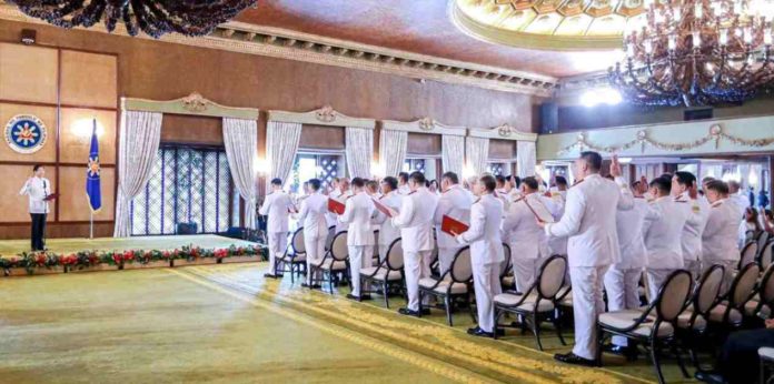 President Ferdinand R. Marcos Jr. (left) urges newly promoted officials of the Philippine National Police (PNP) to work for the people “until the very last day, the last hour” of their service, and to not sit on their laurels, during the oath-taking of star rank officers of the PNP in Malacañang. PCO