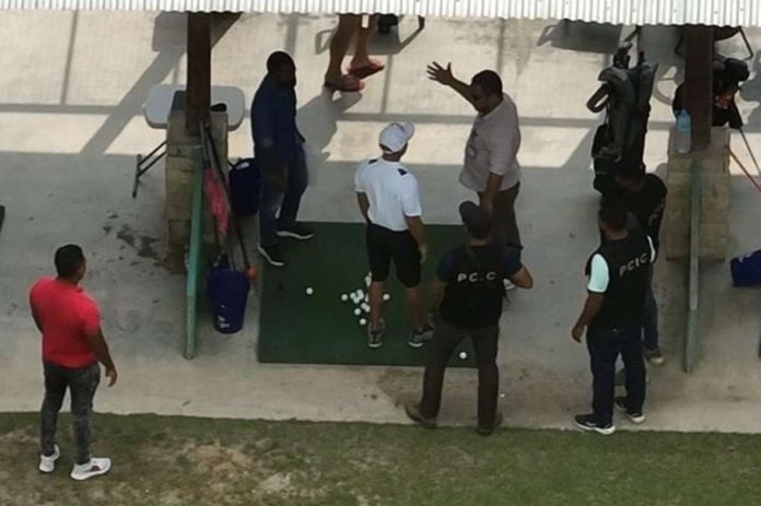 DOJ_resized This photo grabbed from a drone footage shows uniformed and plain-clothed policemen arresting former Negros Oriental congressman Arnolfo Teves Jr. (in while collared shirt and white ball cap) at a golf facility in East Timor.