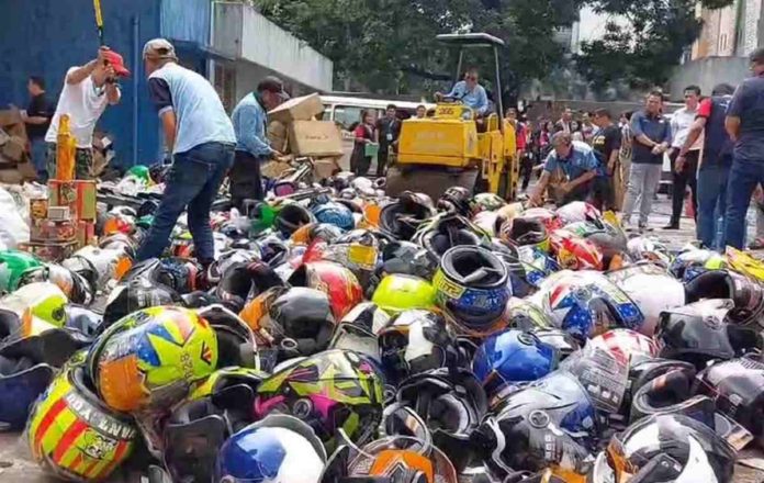 DTI.JPG_resized The Department of Trade and Industry destroys over 3,000 confiscated products worth P1.7 million which include helmets, sanitary wares, fireworks and firecrackers, monobloc chairs, and vapes. PHOTO COURTESY OF ABS-CBN NEWS
