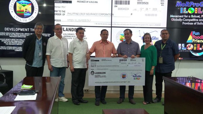 Gov. Arthur Defensor Jr. (4th from left) turned over a check worth P15 million to Philippine Crop Insurance Corporation (PCIC) president, Atty. Jovy Bernabe, as initial funding for the Sustainable Insurance from the Government for Upscaling and Revitalizing the Agri-fisheries Developments and Opportunities program. Photo also shows (from left) Provincial Agriculture Office head Dr. Ildefonso Toledo, Provincial Administrator Raul Banias, Office of Civil Defense Region 6 director Raul Fernandez, PCIC-6 Regional Manager Eva Ulie Laud, and Gareth Bayate of the Department of Agriculture Region 6. BALITA HALIN SA KAPITOLYO FACEBOOK PHOTO