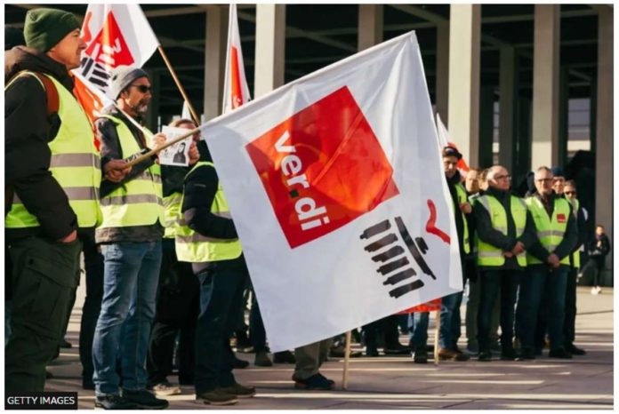 germany_resized Workers demonstrate during a strike organized by the Ver.di union, at Berlin Brandenburg Airport, in Berlin, Germany. GETTY IMAGES