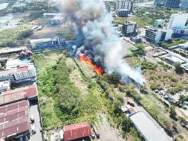A GRASS FIRE broke out on a vacant lot in Barangay San Rafael, Mandurriao, Iloilo City on Wednesday afternoon, March 27, as seen in this drone shot. The Bureau of Fire Protection Region 6 stressed the importance of public cooperation in maintaining clean surroundings to prevent grass and garbage fires especially with the ongoing El Niño phenomenon. ILOILO CITY OPCEN PHOTO