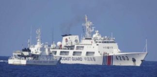 In this June 2023 photo a China Coast Guard vessel maneuvers “dangerously close” to a smaller Philippine Coast Guard ship supporting a resupply mission in Ayungin (Second Thomas) Shoal in the West Philippine Sea. PHOTO COURTESY OF PHILIPPINE COAST GUARD