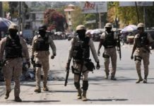 Haitian policemen patrol a street in Port-au-Prince, Haiti to keep gangs at bay. REUTERS