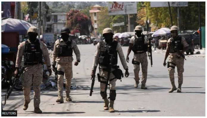 Haitian policemen patrol a street in Port-au-Prince, Haiti to keep gangs at bay. REUTERS