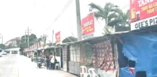Around 50 kiosks occupy what is considered a “dead road,” part of the four-lane road in Barangay Alijis, Bacolod City. The city government has yet to decide whether to temporarily permit their occupancy. SCREENGRAB ISUGID KAY MAYOR