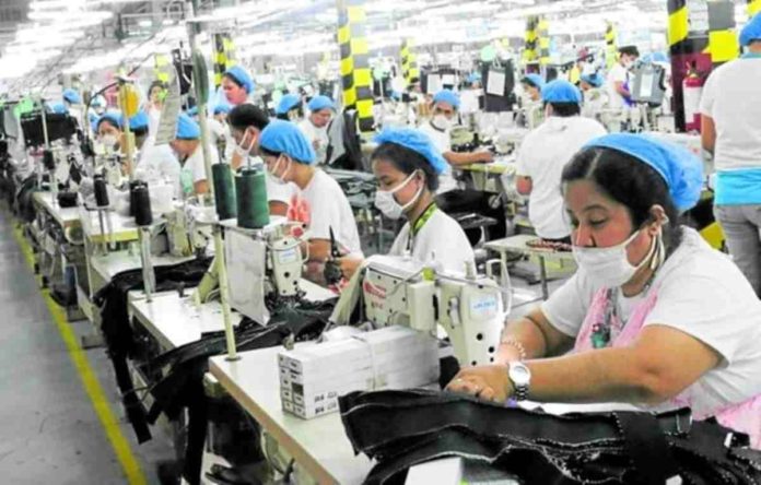 labor_resized According to employers, if a one-time big-time pay hike were to happen, businesses may either push up the cost of goods to make up for losses due to the wage increase, lay off their workers, or firms still recovering from the impact of COVID-19 may be forced to close. Photo shows laborers at work in a factory at the Mactan Export Processing Zone in Lapu-Lapu City. Photo from the Facebook account of the MEPZ Workers Alliance