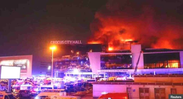 nation PBBM Smoke from fire rises above the burning Crocus City Hall concert venue where gunmen opened fire, killing 115 people. REUTERS
