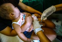 A toddler receives a pentavalent vaccine, which will protect her against diptheria, tetanus, pertussis, influenza type B and hepatitis B, at a health center in Barangay Pinyahan, Quezon City on March 22, 2024. The city government has declared an outbreak of pertussis (whooping cough) after 23 cases and four deaths, mostly infants, from January to March 20. PNA